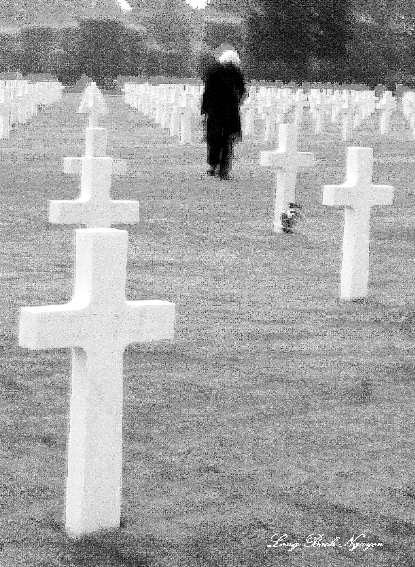 lady in black at Normandy American Cemetery, France