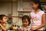 These three children are the ones i walked behind in a Pohnpei giant rainfall... and