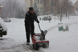 Still smiling and snowblowing!