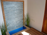 The water feature at the front door.
