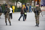Children guarding the tower with machine guns
