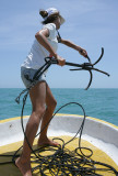 Juans young attractive deck-hand pitching the anchor overboard