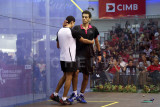 Mohamed El Shorbagy congratulates the younger Tarek Momen (white) for his win.