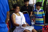 Nicol David signs for young fans
