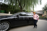 Luxury car is common in Beijing, even in the hutong area