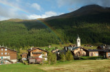 rainbow over mountain church - Livigno