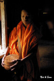 monk with alms bowl