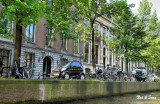 bicycles and  tiny cars line the canals