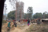 Kids playing near a watertower under construction