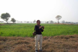 Deepa, looking for the pond amongst the wheat