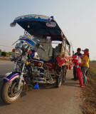 Selling sticky rice in bamboo 'Khaolaam' along the road