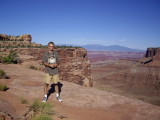Tom at the Schafer Canyon Overlook w. the La Sal Range in the distance. (digital photo by Jacqueline Nelson).