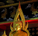 Buddha image, close up, with angels in the background