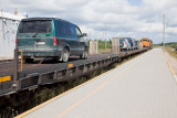 Flatcars with vehicles at head of Polar Bear Express