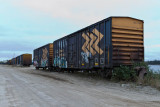 Boxcars along Revillon Road, these are beside the barge docks.