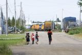 Children watching switching on Revillon Road North (along the Moose River)