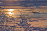 Sunrise reflecting on river ice