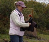 Debbie holding the Pileated Woodpecker