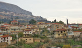 The City of Delphi in the lap of Mount Parnassus overlooking the Amfissa valley with its olive orchards.