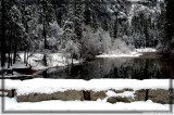 Stoneman Bridge covered with snow and the Merced River