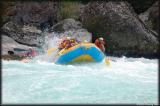 More waves send the raft tilting while Norwood looks on.