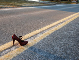 Red Shoe In Road