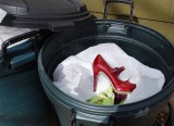 Red Shoe In Trash
