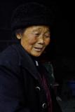 Elder after a long day working in a hilltop structure for worship. Near Ping Shan Po