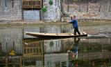 Pushing down the river. Fenghuang, Hunan Province, China