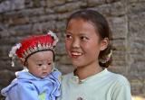 Young mother and child with traditional Miao headwear.