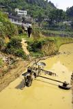 Leaving the field, vehicle used for finale preparation of rice paddies.