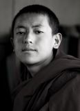 A young monk in a mountain monastery above Lhasa, Tibet.