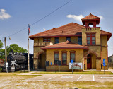 An end view of the station showing the old locomotive displayed at the back of the station.