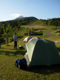 Our campsite overlooking the coast. The onsen bath house is across the roadway.