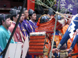 In traditional colorful clothing.