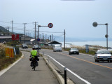 Jay riding into a coastal city