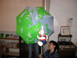 She spoke english well and has lived abroad. Here the rabbit is traveling around the world.