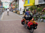 Geno riding through the marketplace.