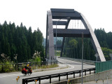 Notices the art work on the left before the bridge.