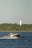 Black Beauty, Classic Chris Craft rounding Preque Isle Lighthouse-Lake Huron, MI