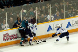 Dany Heatley fights for the puck with Matt DAgostini and Vladimir Sobotka