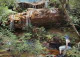Small waterfall, with boys hiding