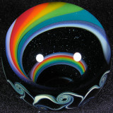 Beautiful dark sparkle glass is seen between the lines of the rainbow.