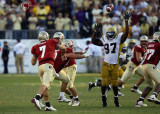 Yellow Jackets DE Robert Hall attempts to block a pass by Seminoles QB Ponder