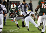 Yellow Jackets S Jake Blackwood knocks Hurricanes WR Laron Byrd out of bounds after a catch