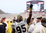 Yellow Jackets DT Richard shows the fans who is number one in the state