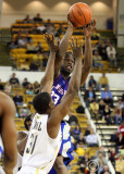 Tech G Lawal gets his hands up to defend the leaping pass by TSU F Gaiter
