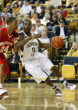 Yellow Jackets G Lewis Clinch attempts to turn the corner along the baseline against Terrapins G Cliff Tucker