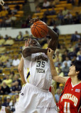 Tech F Zachery Peacock is fouled by Terrapins F Jin Soo Kim as he goes to the basket