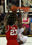 Yellow Jackets F Zachery Peacock leaps in an attempt to stop the short jumper by Wolfpack F Tracy Smith
